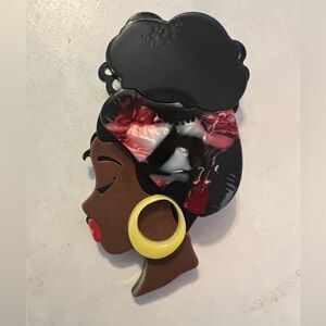 Melanated acrylic brooch